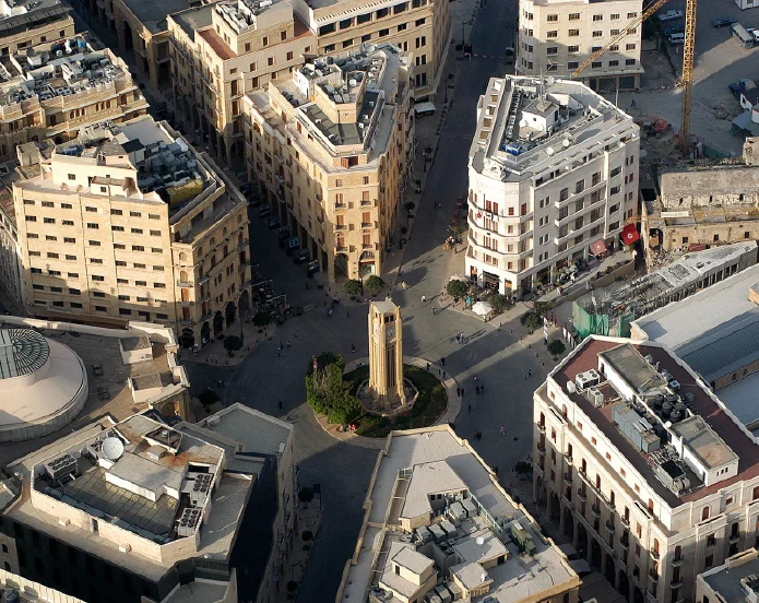 A city with many buildings and a clock tower.