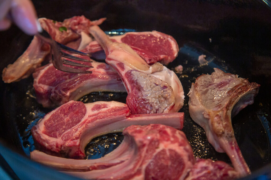 A close up of some meat on the grill