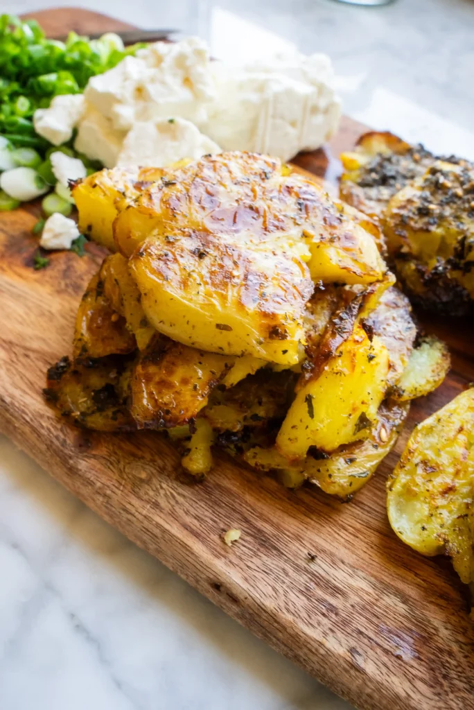 A bunch of potatoes and green beans on the table