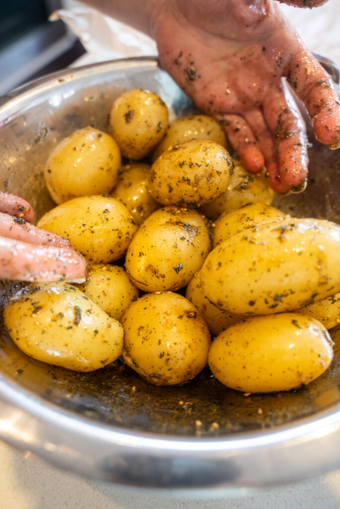 A bunch of potatoes and green beans on the table