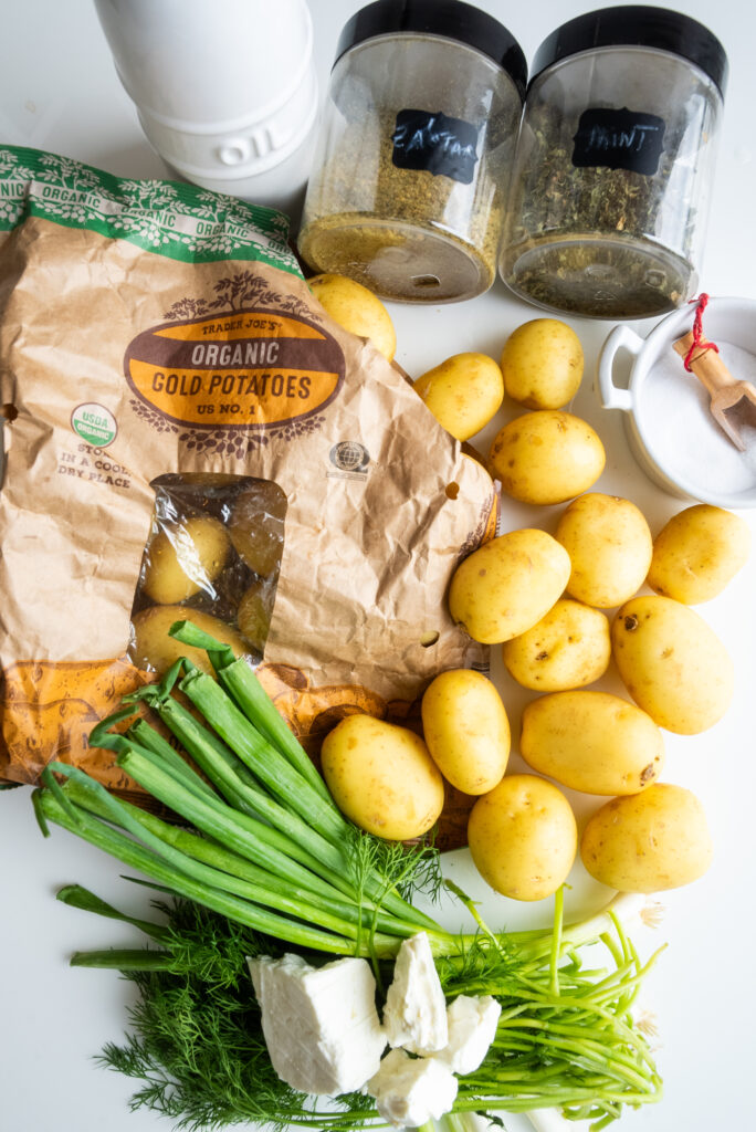 A bunch of potatoes and green beans on the table