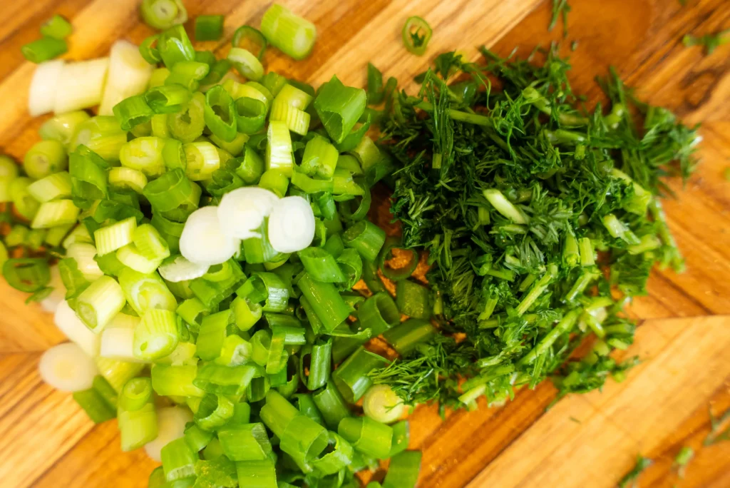 A bunch of potatoes and green beans on the table