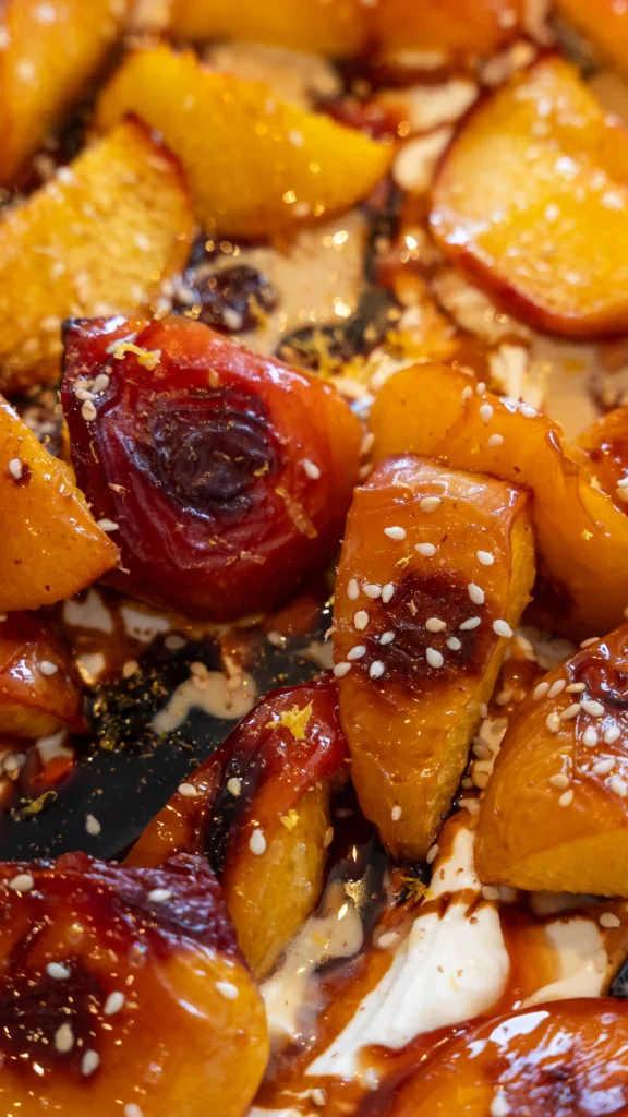 A table topped with bowls of peaches and other food.