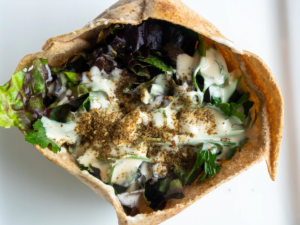 A salad in a paper bag with dressing.