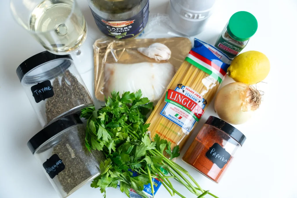 A table topped with lots of food and spices.