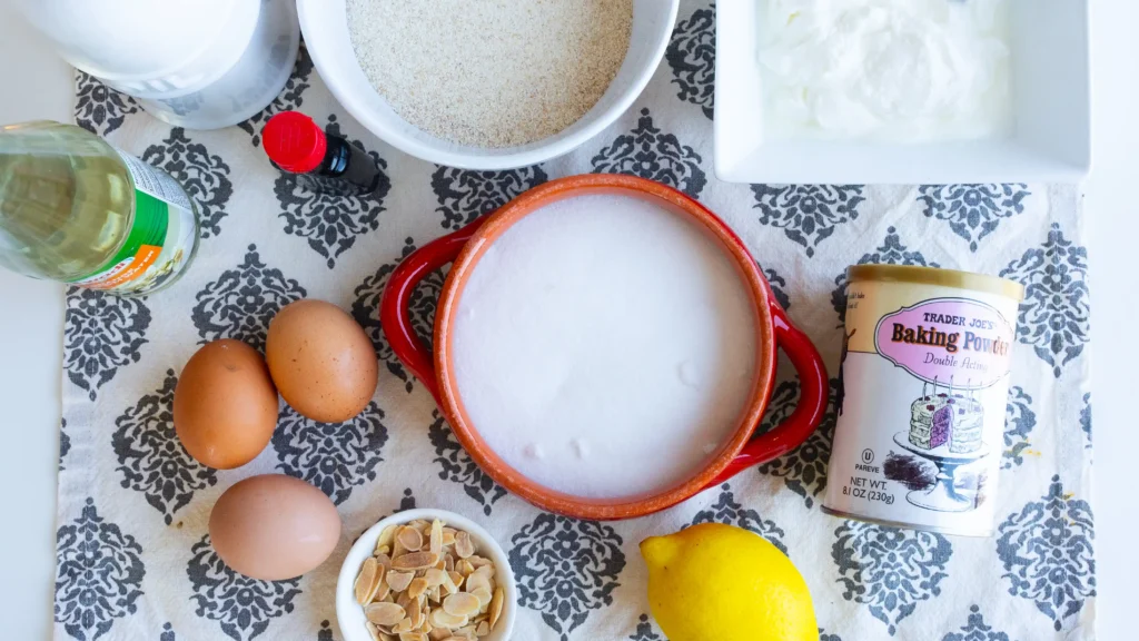 A table topped with bowls of food and milk.