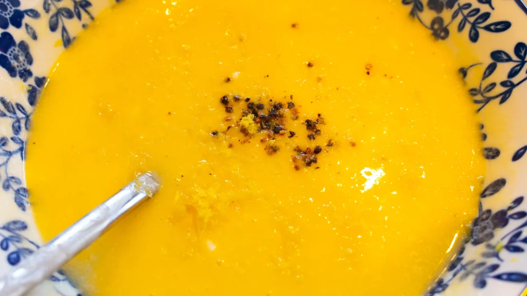 A table topped with bowls of food and milk.